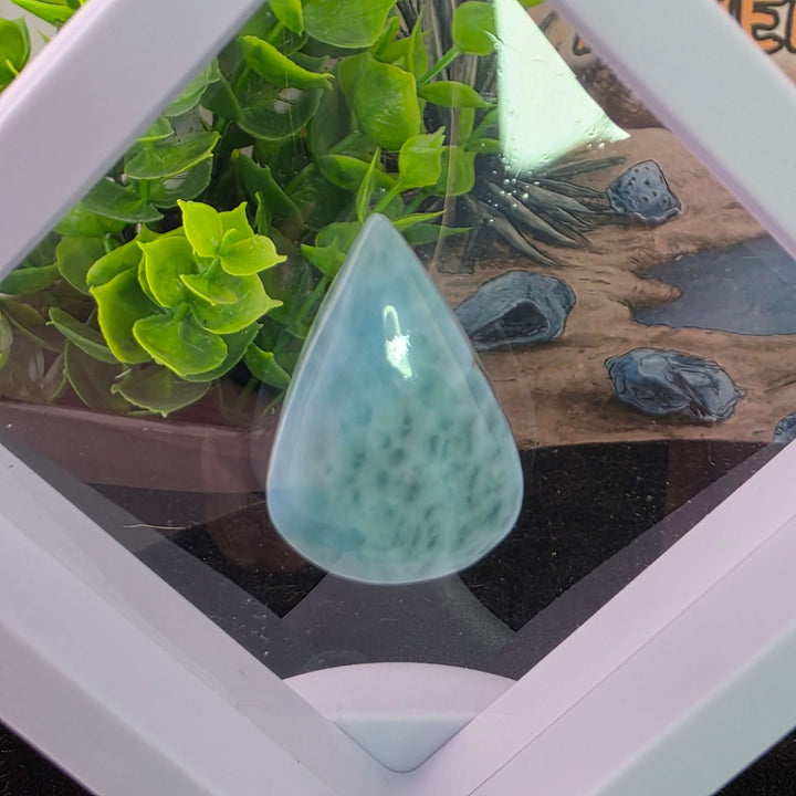 Dive into the tranquil beauty of our Larimar Cabochons. Sourced from the Dominican Republic, these rare and captivating gemstones showcase stunning shades of oceanic blues and whites, reminiscent of Caribbean waters. Each beautifully polished cabochon pai