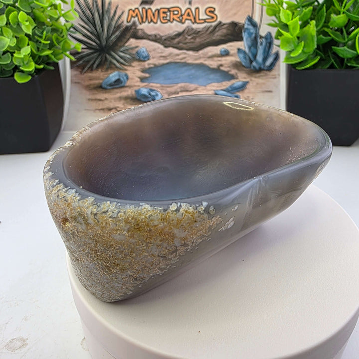 Hand carved Agate Bowl showcasing a smooth interior and rugged exterior, perfect for functional art display.