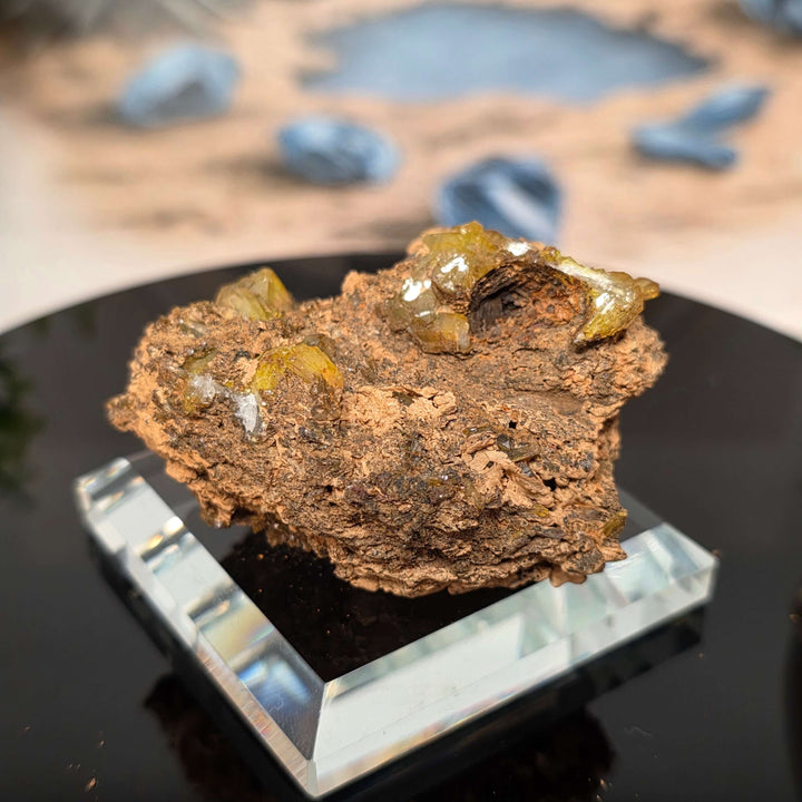 Vibrant Adamite Specimen from Ojuéla Mine exhibiting glowing green crystal formations.