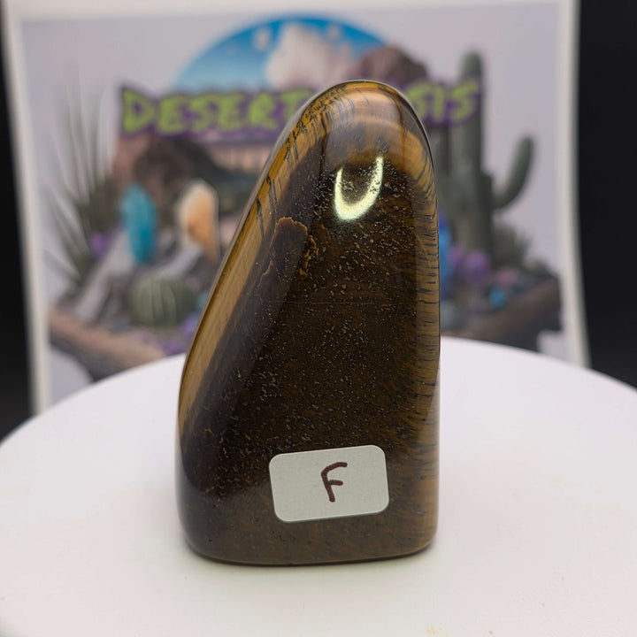 Polished Tiger's Eye freeform sculpture with golden chatoyancy and smooth finish, showcasing natural beauty.