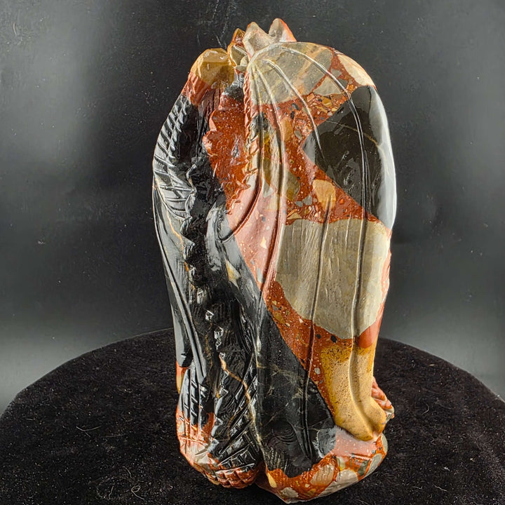 Jasper Sitting Dragon Carving, detailed sculpture in warm reds and blacks, over six inches tall.