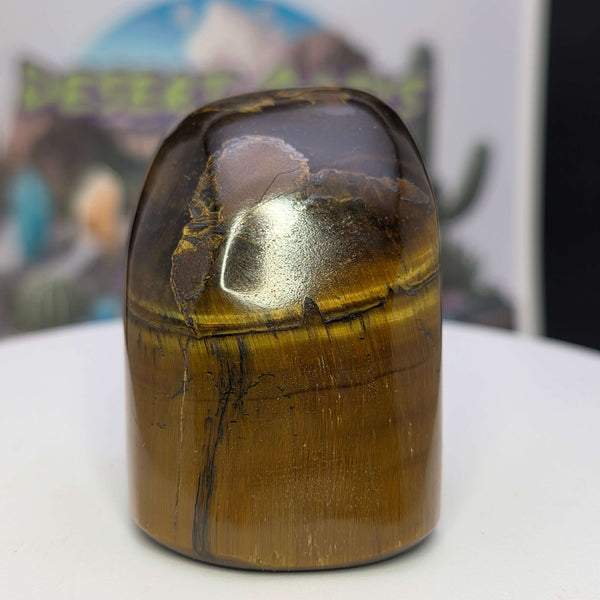 Polished Tiger's Eye freeform showcasing its golden color and shimmering chatoyancy effect.