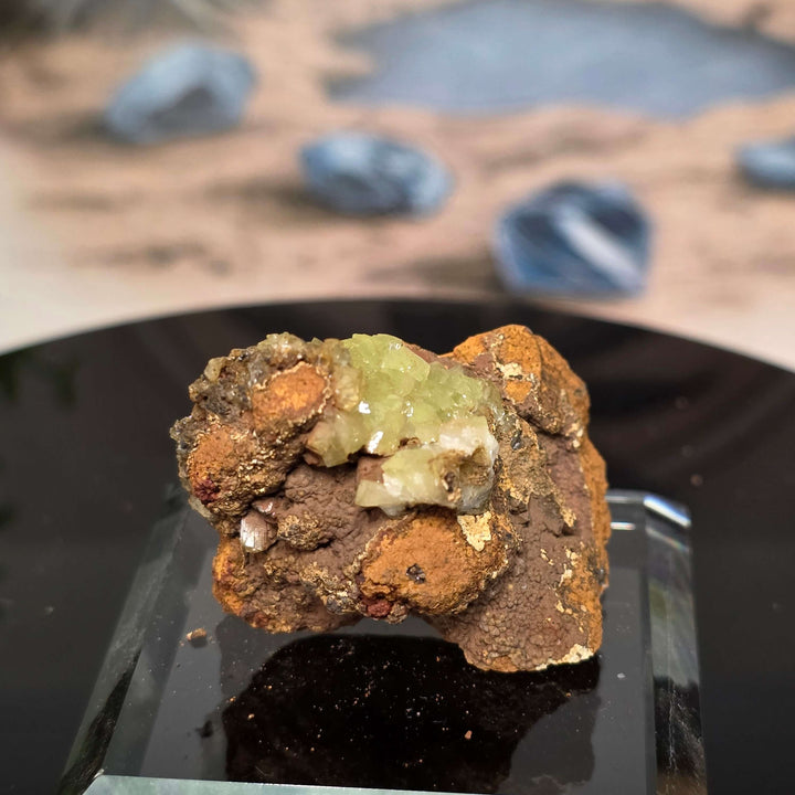 Vibrant Adamite Specimen from Ojuéla Mine exhibiting glowing green crystal formations.