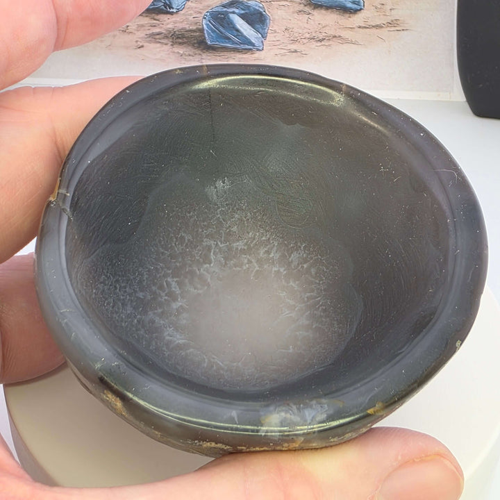 Hand carved Agate Bowl showcasing a smooth interior and rugged exterior, perfect for functional art display.