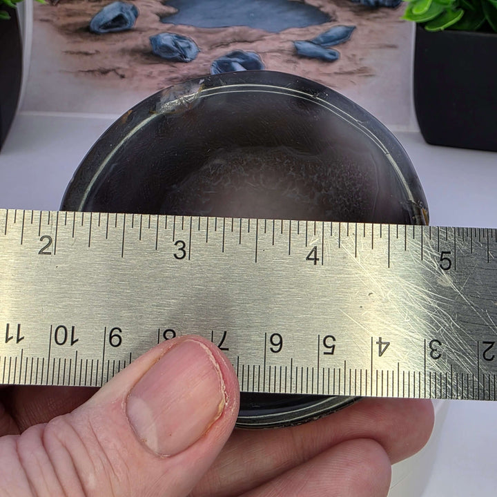 Hand carved Agate Bowl showcasing a smooth interior and rugged exterior, perfect for functional art display.