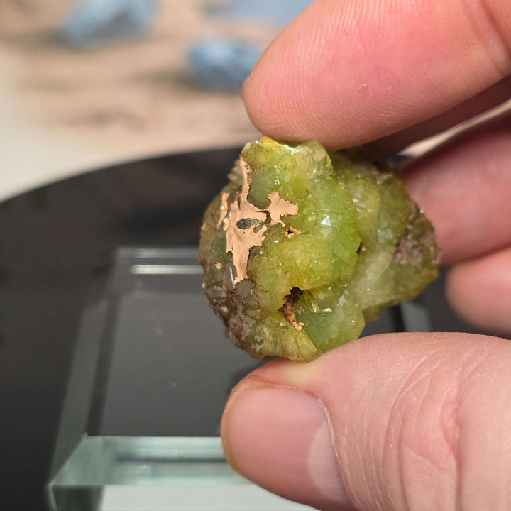 Vibrant Adamite Specimen from Ojuéla Mine exhibiting glowing green crystal formations.