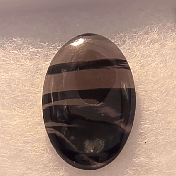 Unveil the captivating depths of our Midnight Lace Obsidian Cabochons These exquisitely polished cabochons feature the distinctive subtle banding and intricate patterns unique to Midnight Lace Obsidian, reminiscent of a moonlit night sky. Each pair is ele