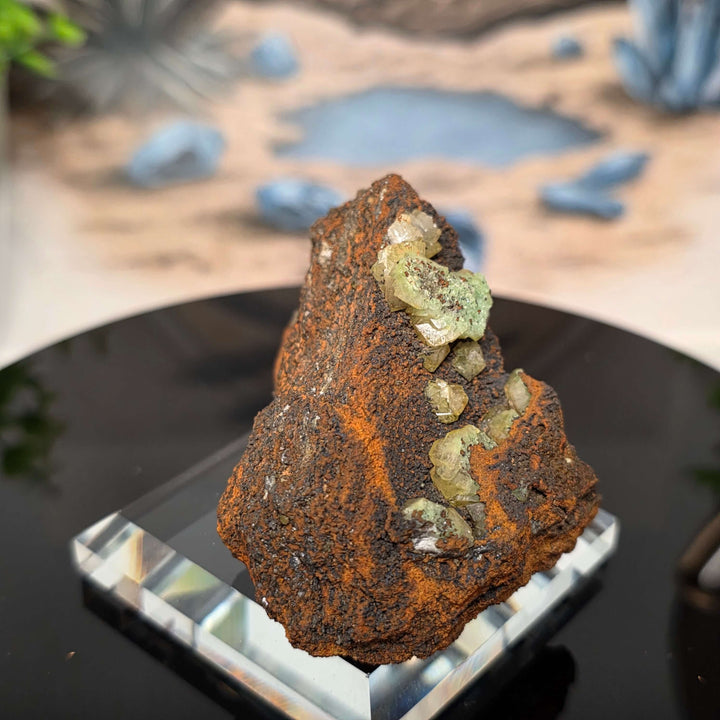 Vibrant Adamite Specimen from Ojuéla Mine exhibiting glowing green crystal formations.