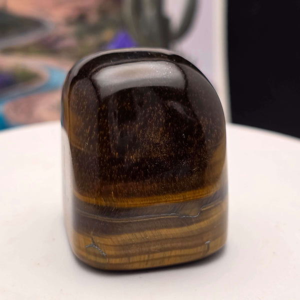Polished Tiger's Eye freeform displaying golden chatoyancy and smooth finish, perfect for home decor or crystal collection.