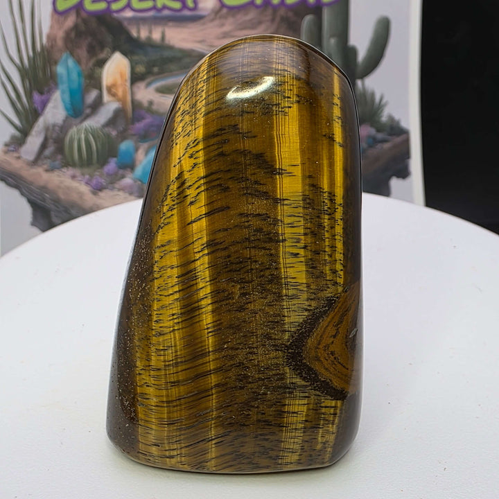 Polished Tiger's Eye freeform showcasing golden chatoyancy and smooth finish, perfect for collectors and home decor.