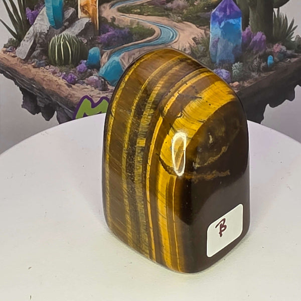 Polished Tiger's Eye freeform with golden chatoyancy, showcasing its striking shimmer and unique shape.