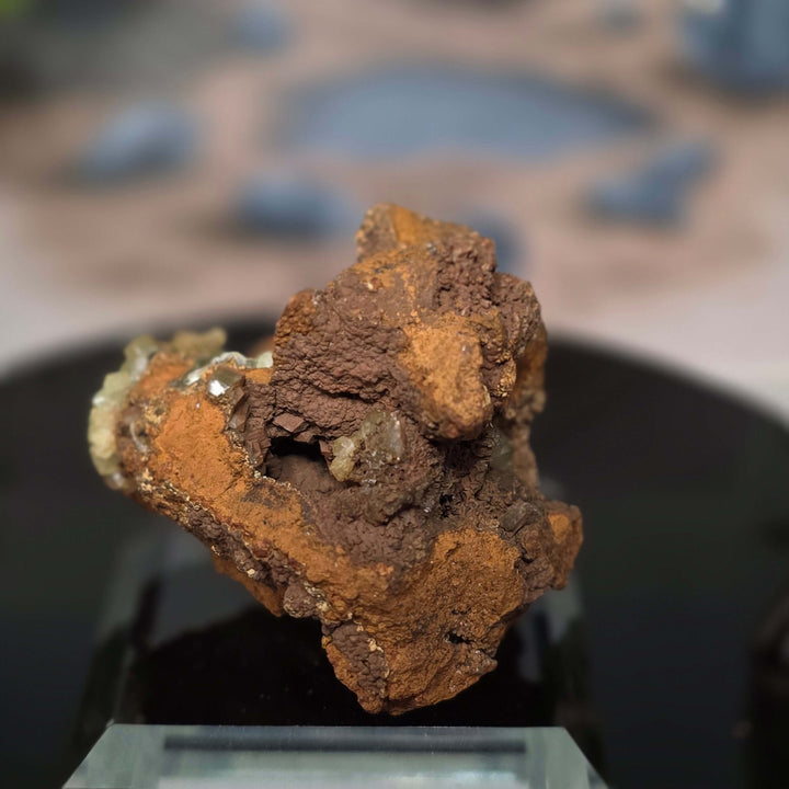 Vibrant Adamite Specimen from Ojuéla Mine exhibiting glowing green crystal formations.