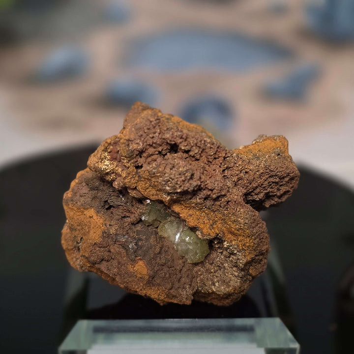 Vibrant Adamite Specimen from Ojuéla Mine exhibiting glowing green crystal formations.