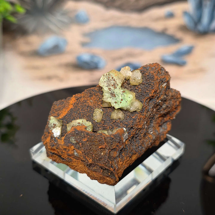 Vibrant Adamite Specimen from Ojuéla Mine exhibiting glowing green crystal formations.