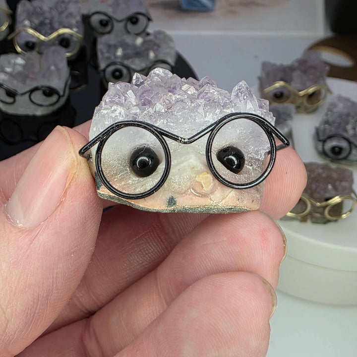 Crystal Buddies - Specimen Carvings featuring a cute crystal hedgehog with glasses.