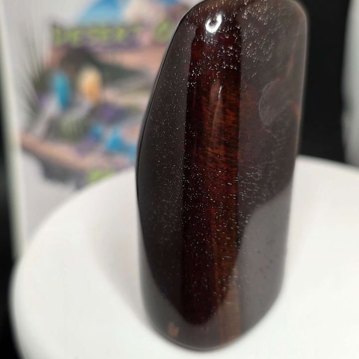 Polished Red Tiger's Eye freeform showcasing deep reddish-brown hues and a smooth finish, ideal for collectors and enthusiasts.