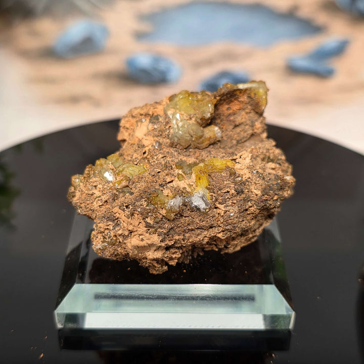 Vibrant Adamite Specimen from Ojuéla Mine exhibiting glowing green crystal formations.