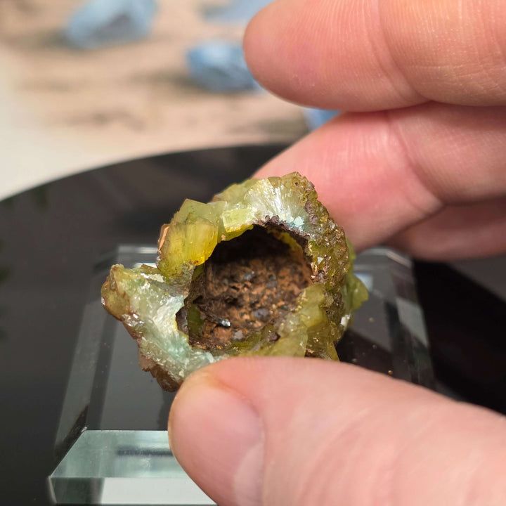 Vibrant Adamite Specimen from Ojuéla Mine exhibiting glowing green crystal formations.