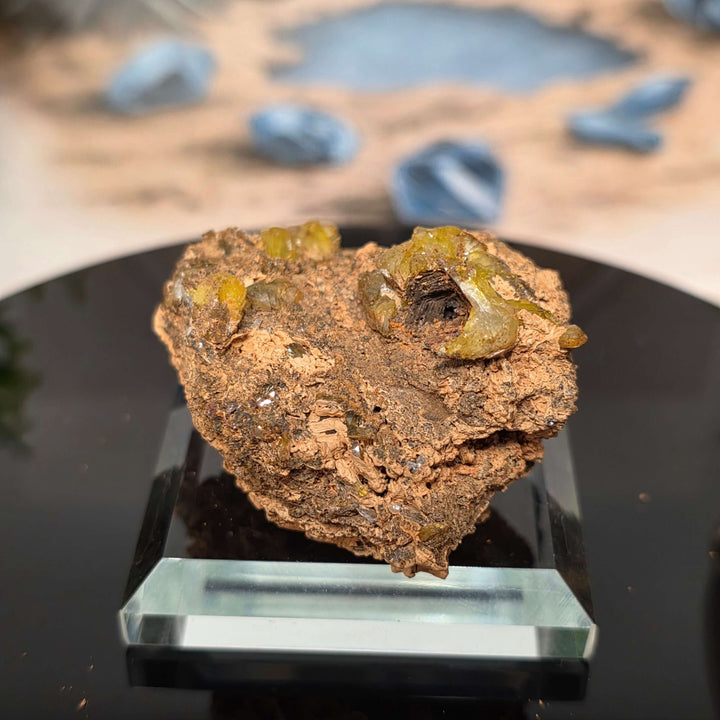 Vibrant Adamite Specimen from Ojuéla Mine exhibiting glowing green crystal formations.