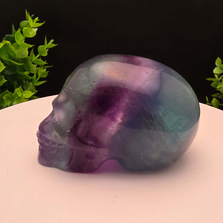 Rainbow Fluorite skull carving - 2.5 Inch; showcasing purple and blue hues, stunning details, and intricate craftsmanship.