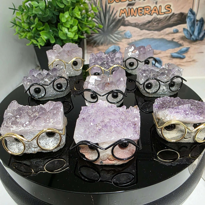 Various Crystal Buddies - Specimen Carvings wearing glasses, showcasing unique natural crystal designs.