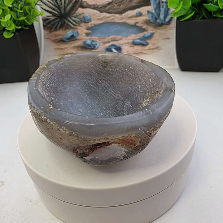 Hand carved Agate Bowl showcasing a smooth interior and rugged exterior, perfect for functional art display.