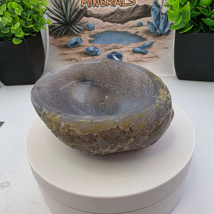 Hand carved Agate Bowl showcasing a smooth interior and rugged exterior, perfect for functional art display.